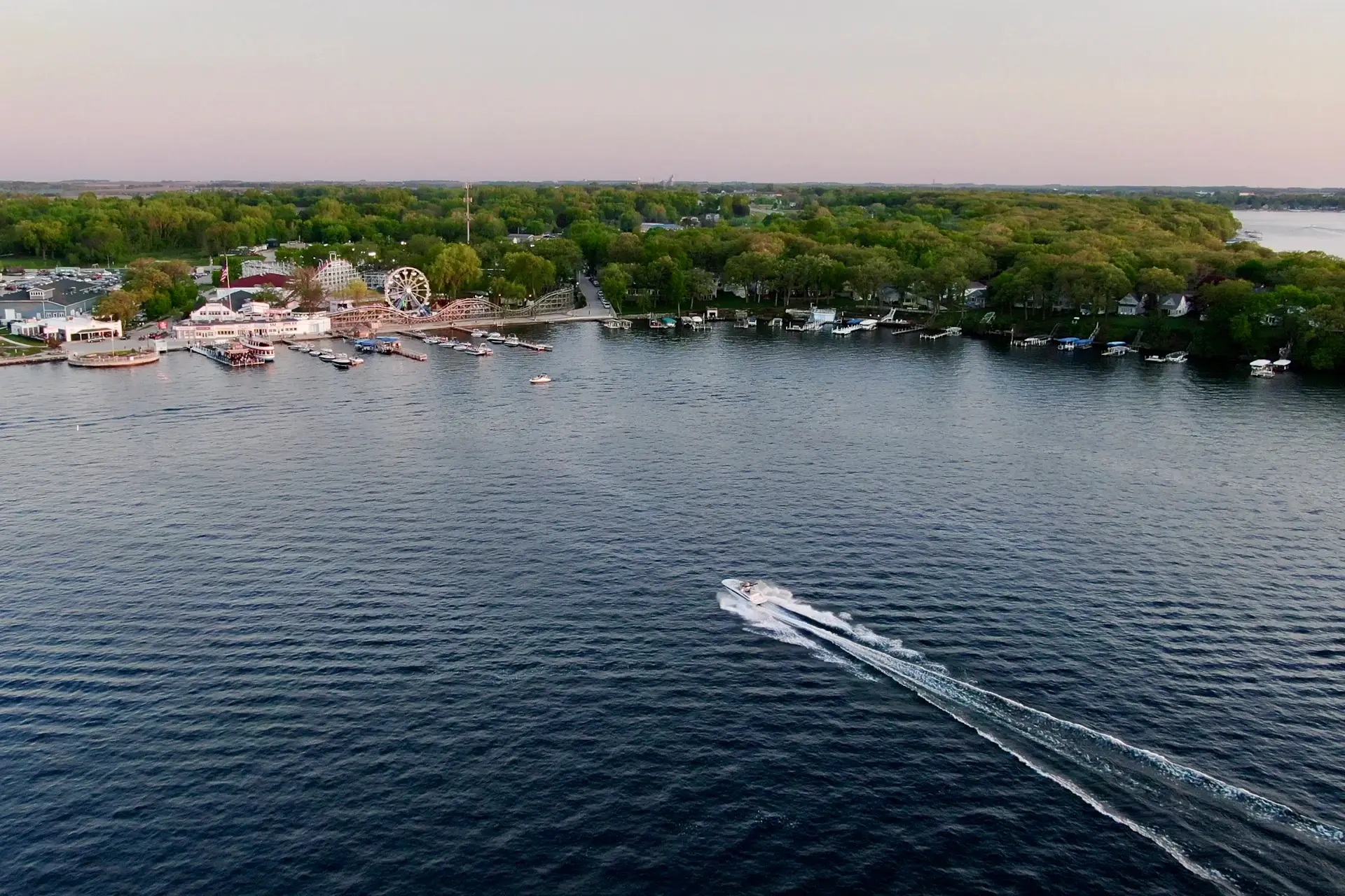 Aerial view of Arnolds Park and West Okoboji Lake at dusk