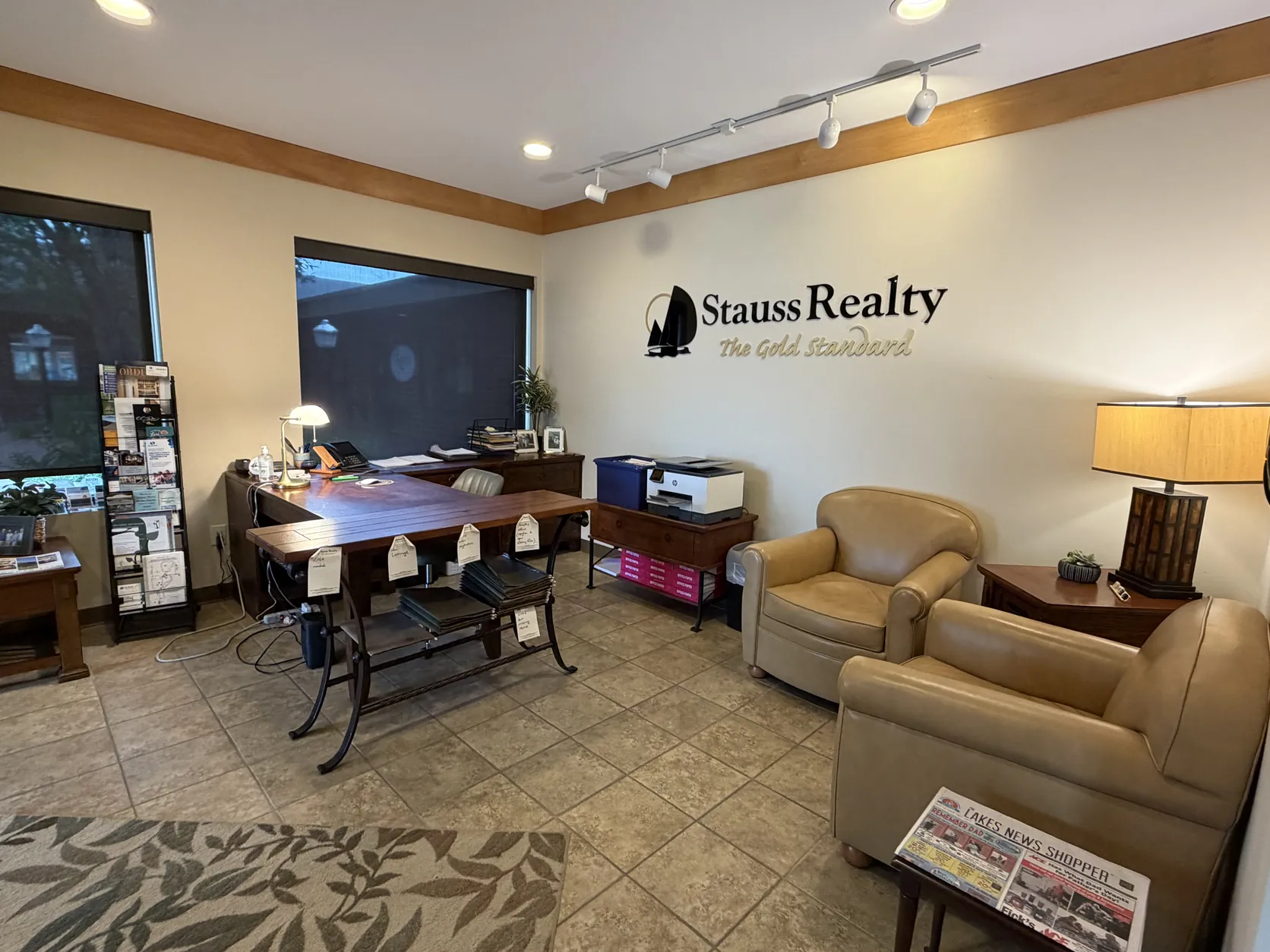 Client seating area inside the Stauss Realty office at 1003 Hwy 71 South in Okoboji, Iowa