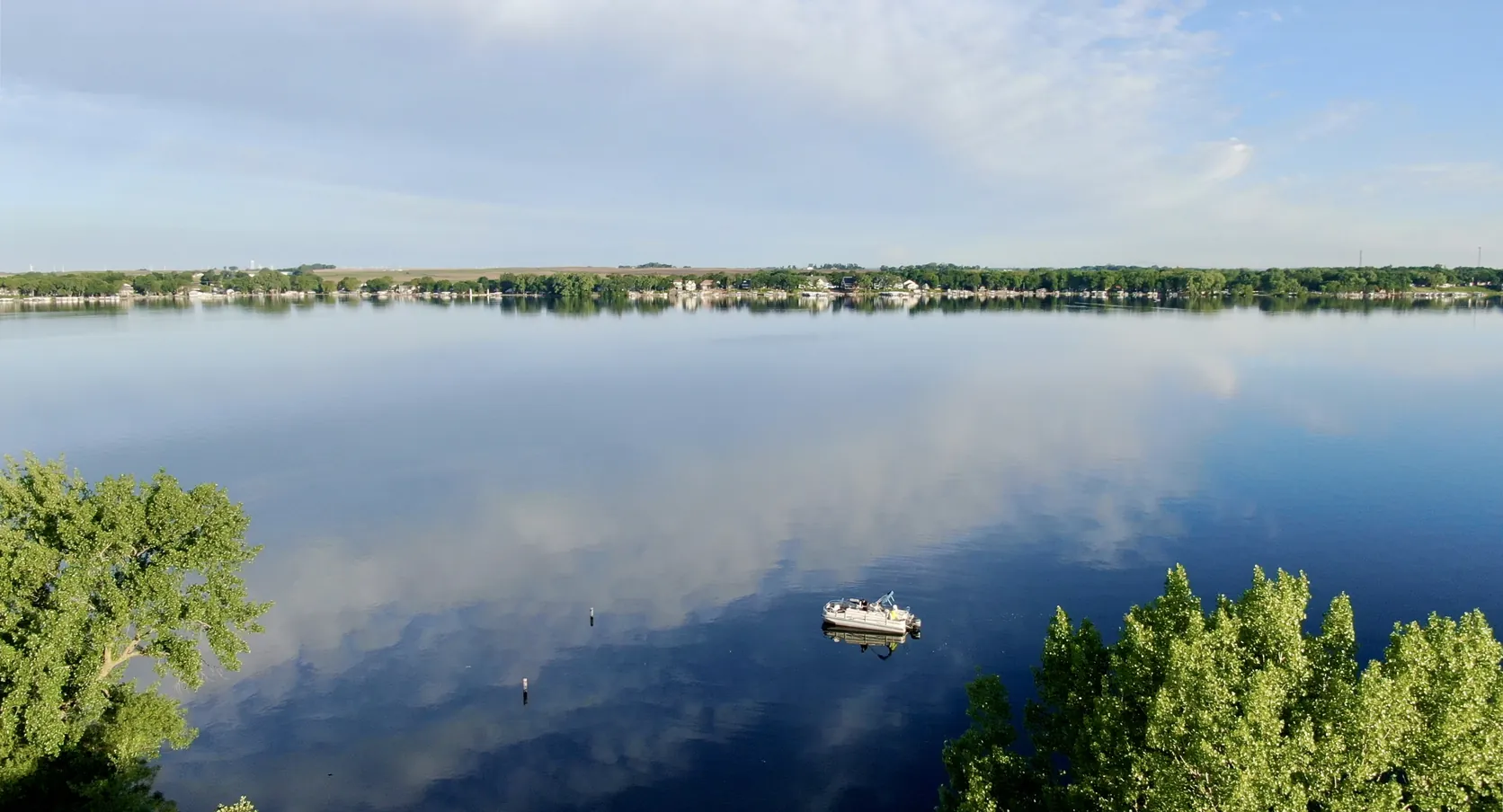Still morning water off Pikes Point on West Lake Okoboji, the lake the City of West Okoboji, Iowa is named for