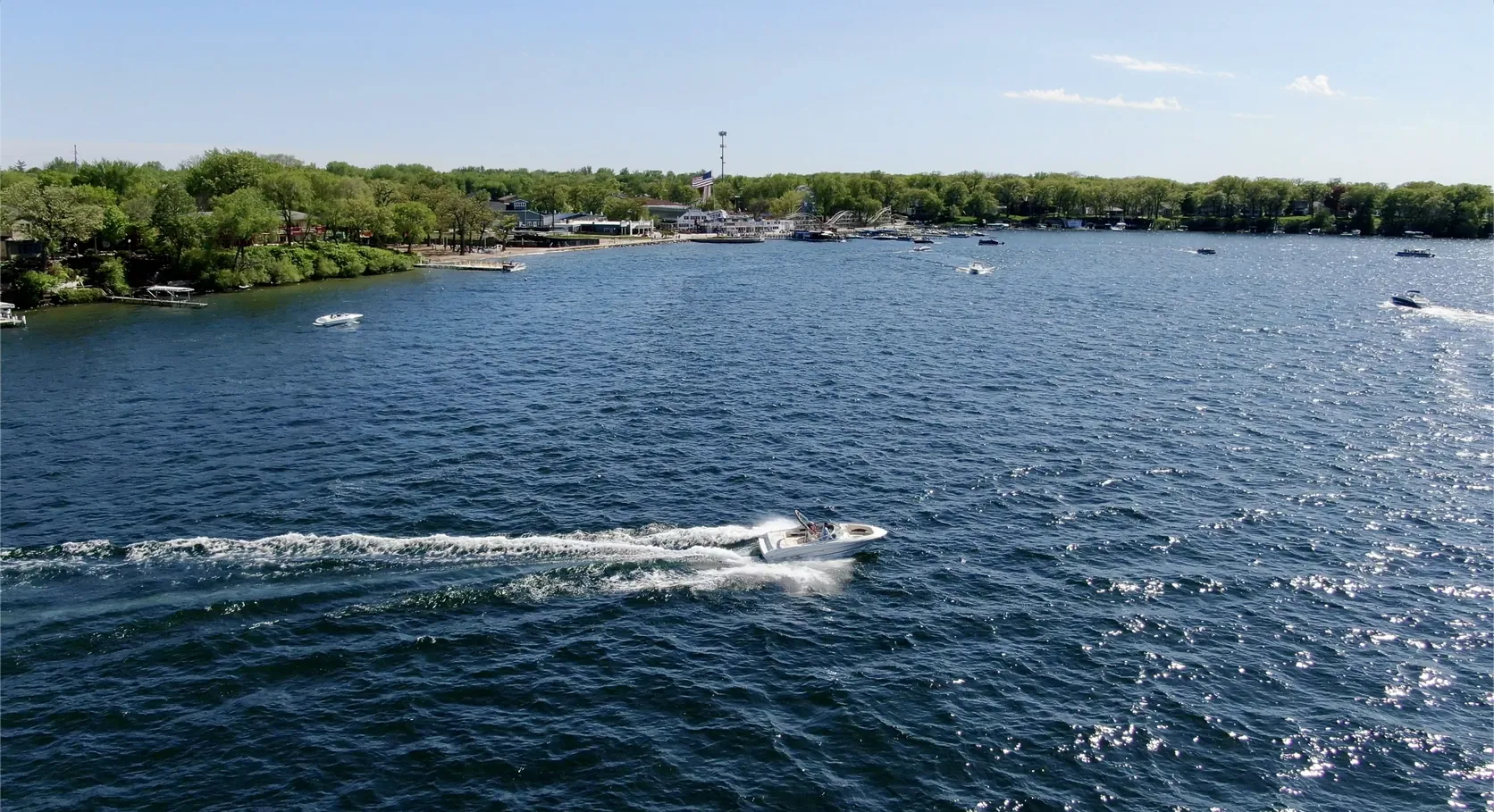 A boat crossing Smith's Bay on West Lake Okoboji, Iowa in summer