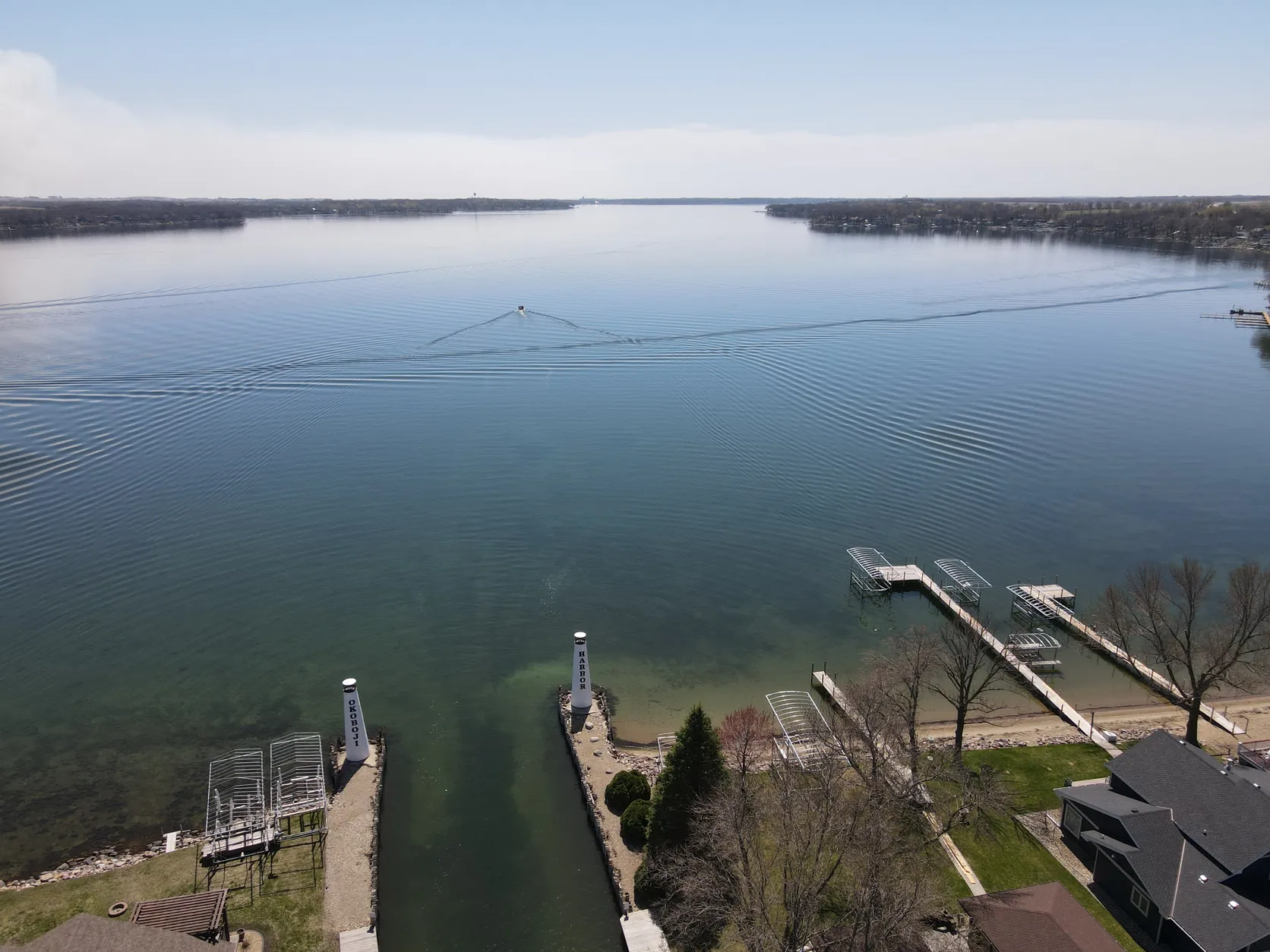 Aerial view of lake lots, homes and docks at West Okoboji Harbor on West Lake Okoboji, Iowa
